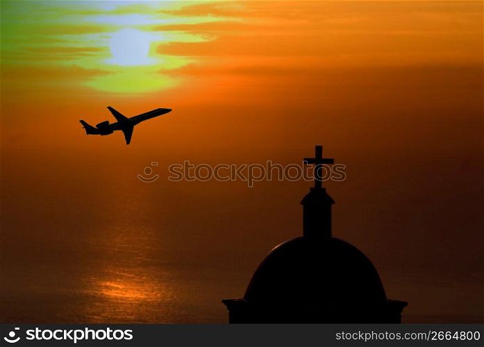 Silhouette of aircraft with church