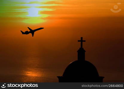 Silhouette of aircraft with church