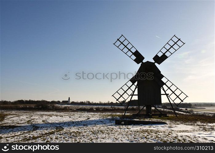 Silhouette of an old wooden windmill in winter season at the swedish island Oland