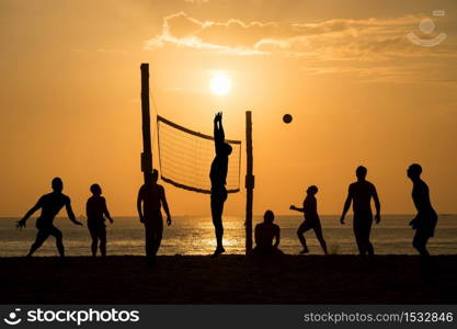 silhouette of beach Volleyball player on the beach and playground sand in sunset