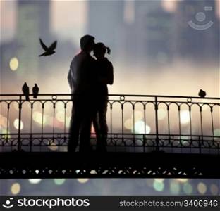 silhouette of bridge and pair of lovers on city background