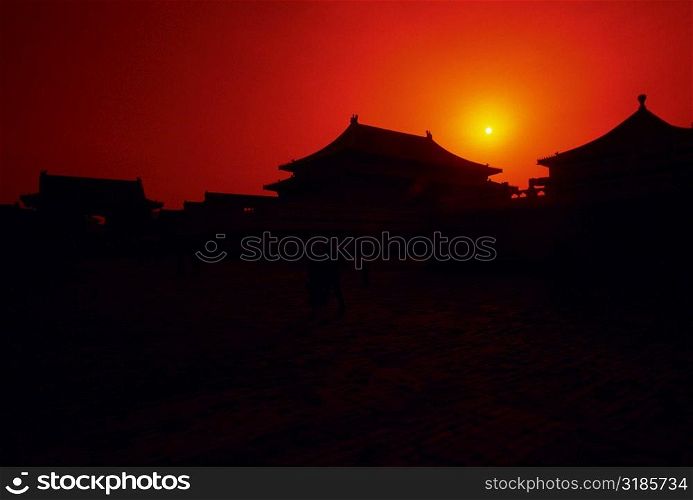 Silhouette of buildings at sunset, Forbidden City, Beijing, China