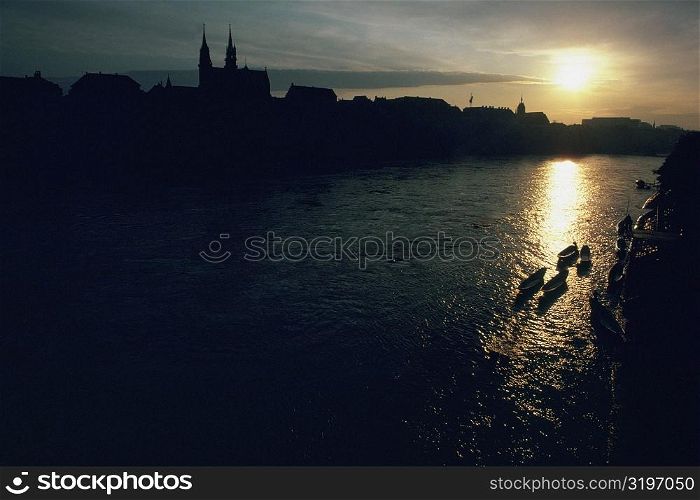 Silhouette of buildings at the waterfront, Rhine River, Basel, Switzerland