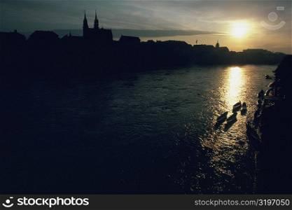 Silhouette of buildings at the waterfront, Rhine River, Basel, Switzerland