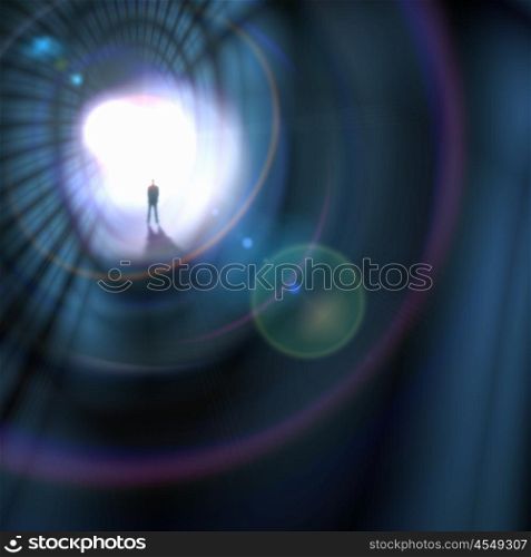 Silhouette of businessman in tunnel. Silhouette of businessman standing in color background