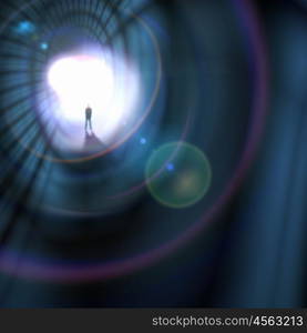 Silhouette of businessman in tunnel. Silhouette of businessman standing in color background