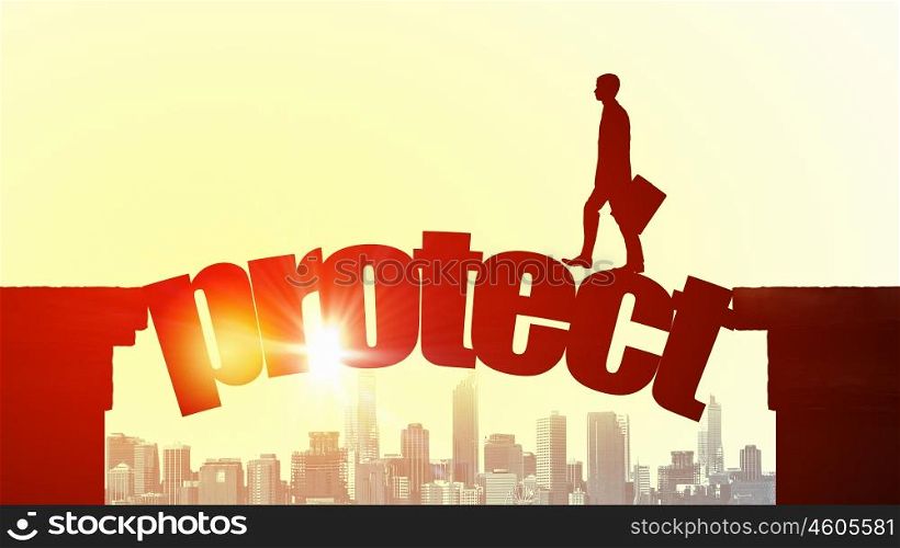 Silhouette of businessman over sunrise. Businessman running on protect word bridge over precipice