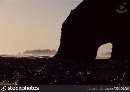 Silhouette of Cave on Beach