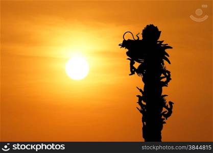 silhouette of chinese dragon with beautiful sunset background