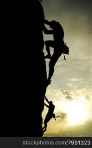 Silhouette of climber at the sunset. Element of deisgn.
