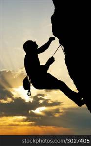 Silhouette of climber at the sunset. Element of design. . Silhouette of climber at the sunset.