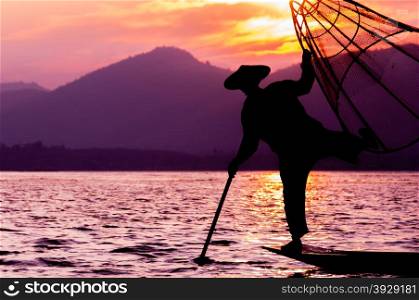 Silhouette of fisherman at sunset Inle Lake. Silhouette of fisherman at sunset Inle Lake Burma Myanmar