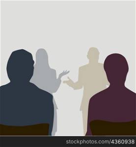 Silhouette of four people standing together