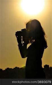 silhouette of girl isolated on sunset background in shooting time