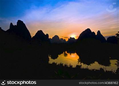 Silhouette of hills at dawn, Guilin Hills, Li River, Yangshuo, Guangxi Province, China
