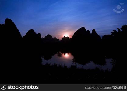 Silhouette of hills at dusk, Guilin Hills, Li River, Yangshuo, Guangxi Province, China