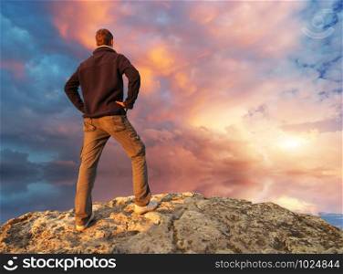 silhouette of man on top of mountain. Conceptual scene.