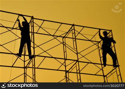 silhouette of man working for construction