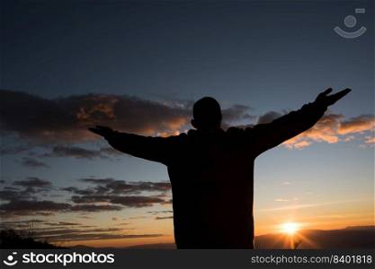 Silhouette of People raising Hand of God