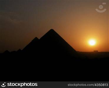 Silhouette of pyramids at sunset, Giza Pyramids, Giza, Cairo, Egypt