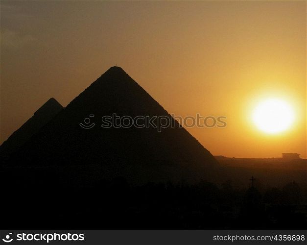 Silhouette of pyramids at sunset, Giza Pyramids, Giza, Cairo, Egypt