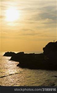 Silhouette of rocks in the ocean, Baie de Biarritz, Biarritz, France