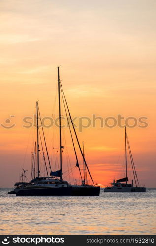 silhouette of sail boat on sea at sunset ,phuket,thailand