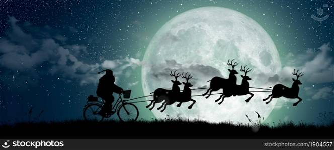 Silhouette of Santa Claus get a move to ride on their reindeer over full moon at night Christmas. Merry Christmas and Happy holiday.
