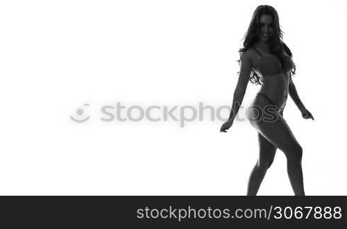 silhouette of sexy dancing woman in lingerie