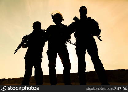 Silhouette of special forces operators with weapons. Silhouette of soldier