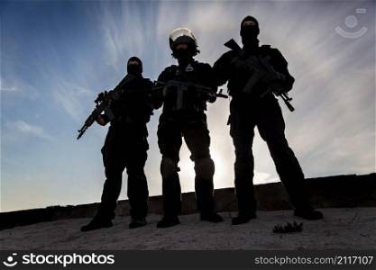 Silhouette of special forces operators with weapons. Silhouette of soldier