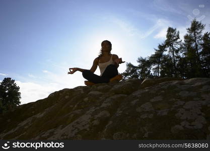 Silhouette Of Teenage Girl Meditating Outdoors