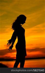 Silhouette of the beautiful young mother