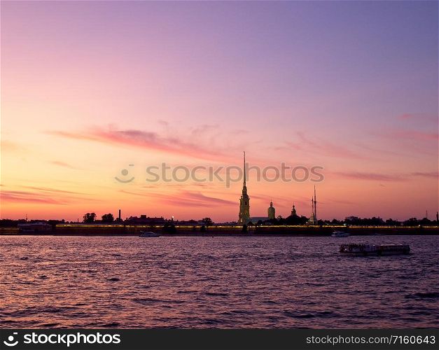 Silhouette of the Peter and Paul Fortress against the setting sun. Peter and Paul Fortress at sunset