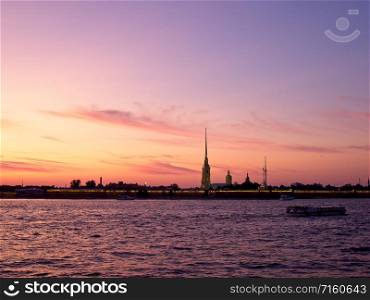 Silhouette of the Peter and Paul Fortress against the setting sun. Peter and Paul Fortress at sunset