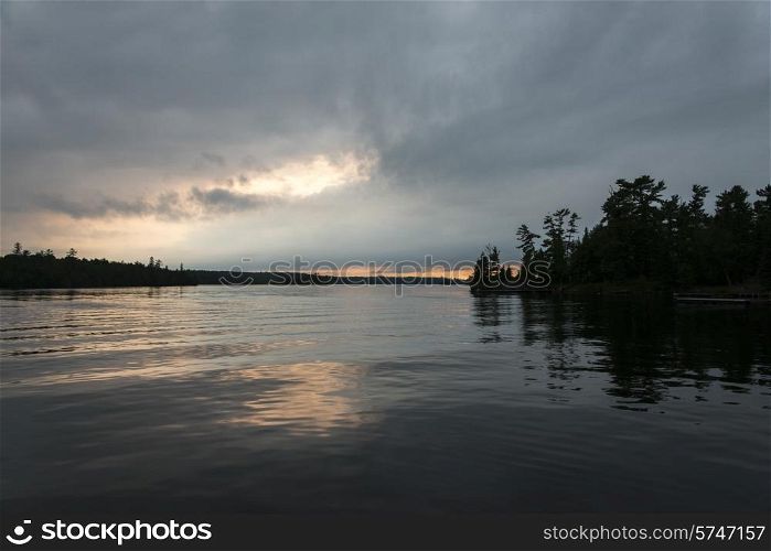 Silhouette of trees at dusk, Lake of The Woods, Ontario, Canada