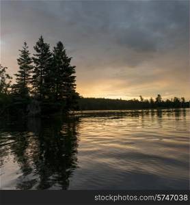 Silhouette of trees at Sunset, Lake of The Woods, Ontario, Canada