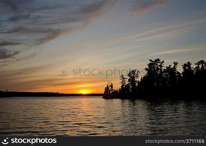 Silhouette of trees at the lakeside, Lake of the Woods, Ontario, Canada