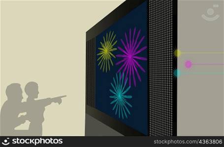 Silhouette of two people looking at a projection screen