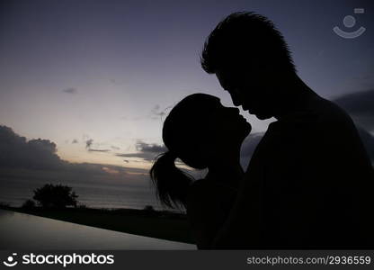 Silhouette of young couple at the beach