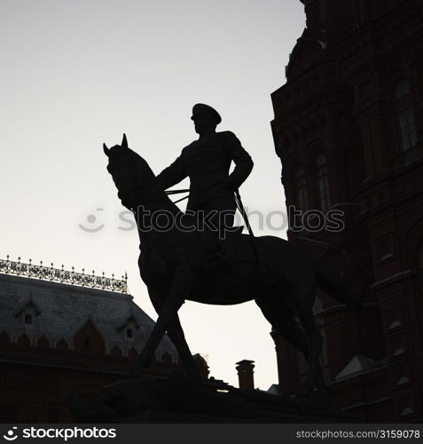 Silhouette statue of a horse and rider