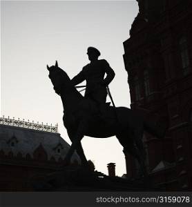 Silhouette statue of a horse and rider