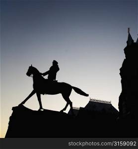 Silhouette statue of a horse and rider