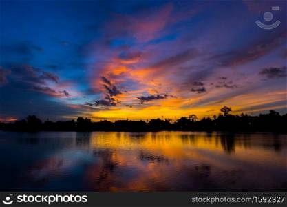 silhouette twilight sky on lagoon background