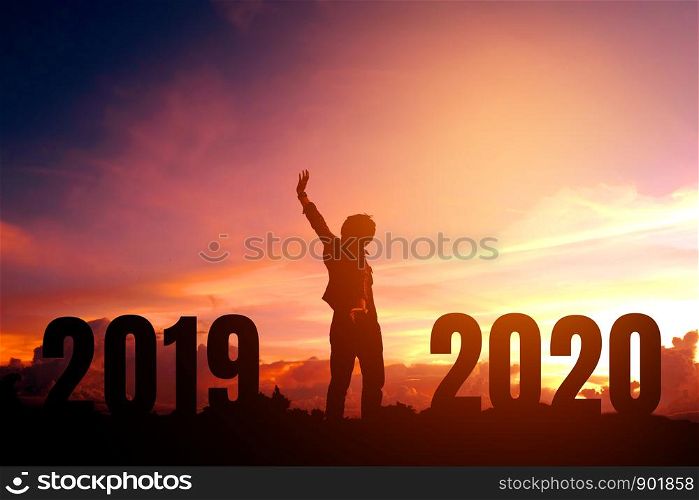Silhouette young man happy to 2020 new year