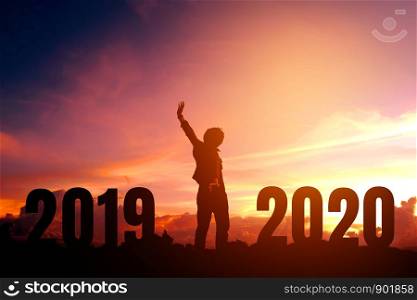Silhouette young man happy to 2020 new year