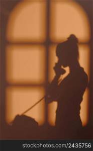 silhouette young woman home with window shadows