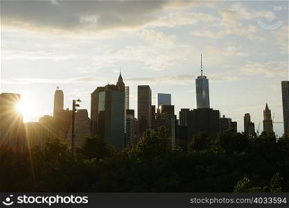 Silhouetted view of lower Manhattan at dawn, New York, USA
