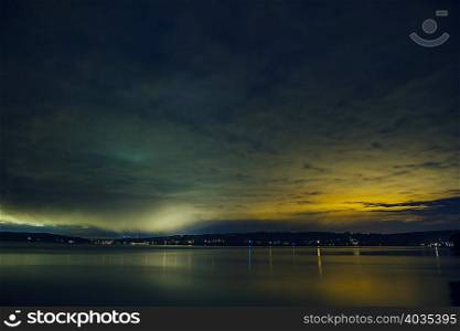 Silhouetted view of Puget Sound at night, Seattle, Washington State, USA