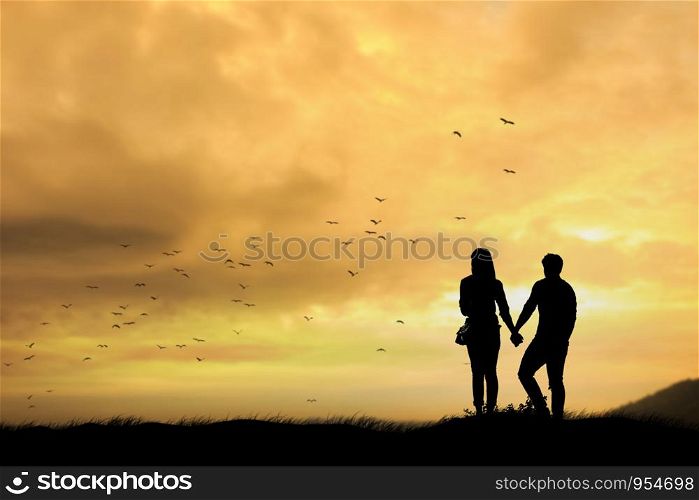 silhouettes of a man and women during sunset